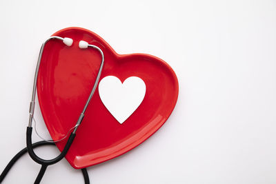 High angle view of heart shape on white background