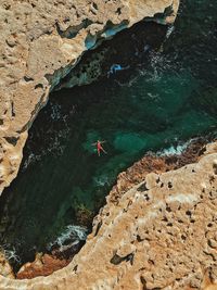 Aerial view of man swimming in sea