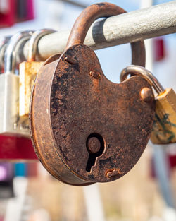 Close-up of padlock on rusty chain