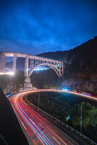 High angle view of light trails on road at night