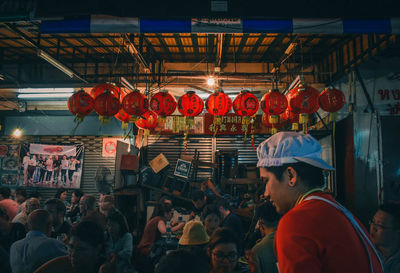 Group of people at market stall