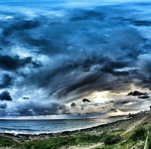 Scenic view of sea against cloudy sky