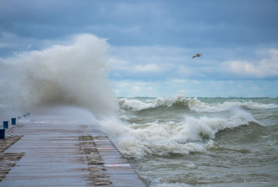 Waves breaking against sea