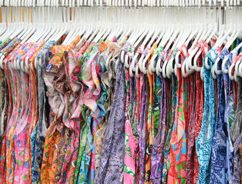 Multi colored flags hanging on rack in store