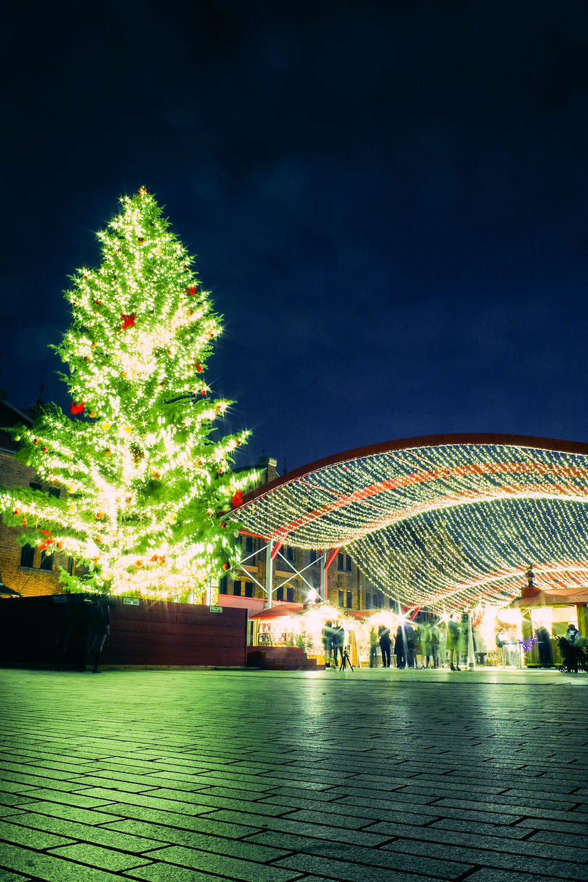 night, arts culture and entertainment, illuminated, amusement park, outdoors, sky, amusement park ride, architecture, travel destinations, no people, ferris wheel, tree, building exterior