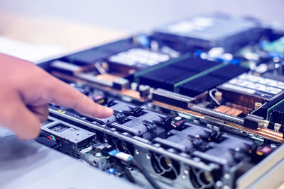 Cropped hand repairing circuit board