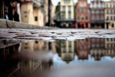 Reflection of buildings in puddle