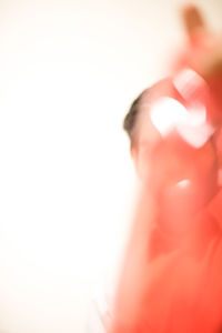 Close-up of hands over white background