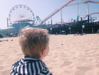 Close-up rear view of boy at santa monica pier