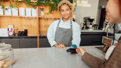 Portrait of young man working at table