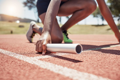 Low section of woman exercising in gym