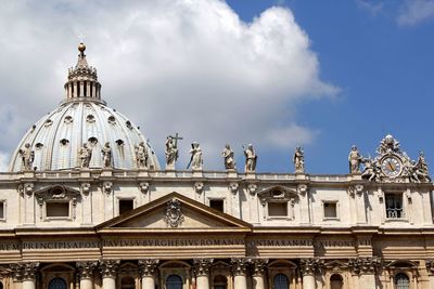 Low angle view of historical building against cloudy sky