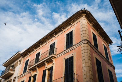 Low angle view of old building against sky