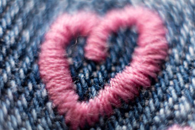 Detail shot of heart shape on jeans