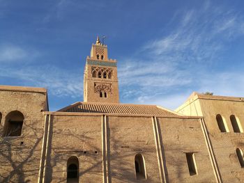 Low angle view of bell tower against sky