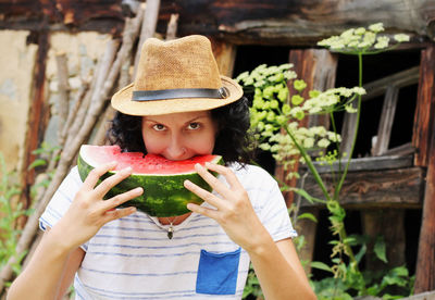 Woman eating watermelon slice