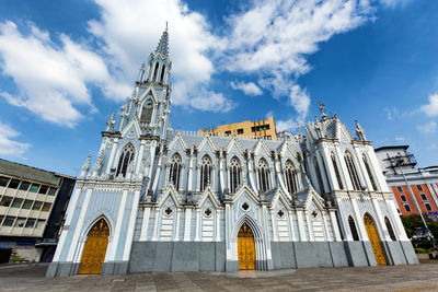 Low angle view of cathedral against cloudy sky