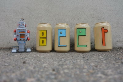 Close-up of toy toys against wall