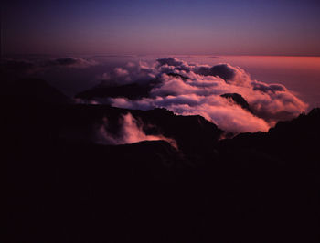 Scenic view of silhouette mountain against sky at sunset