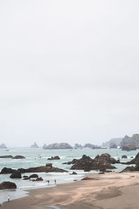 Scenic view of beach against clear sky