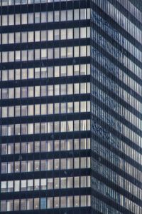 Full frame shot of modern glass building in city