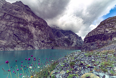 Scenic view of lake and mountains against sky