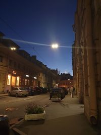 City street and buildings against sky