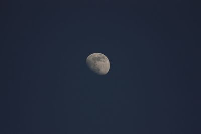 Low angle view of moon against sky at night