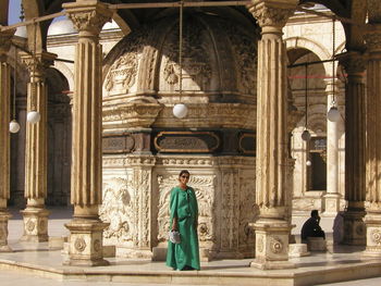 Woman standing in courtyard at mosque of muhammad ali