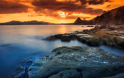 Scenic view of sea against sky during sunset