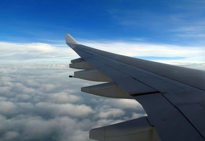 Low angle view of airplane flying in sky