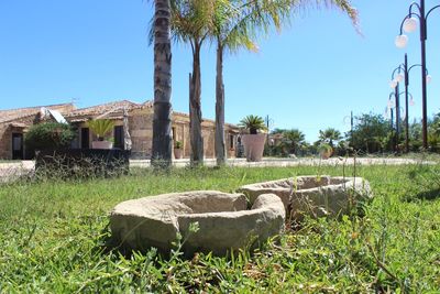 Built structure on field against clear sky