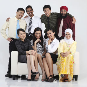 Portrait of smiling colleagues against white background