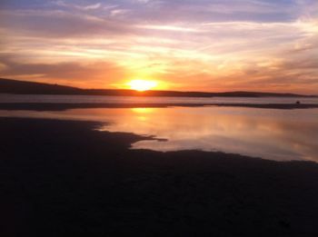 Scenic view of sunset over river