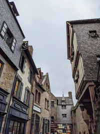 Low angle view of old medieval buildings against sky