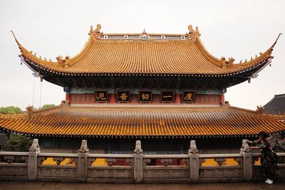 Temple outside building against clear sky