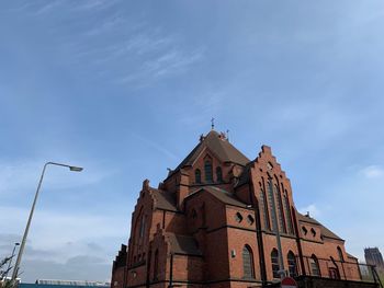 Low angle view of building against blue sky