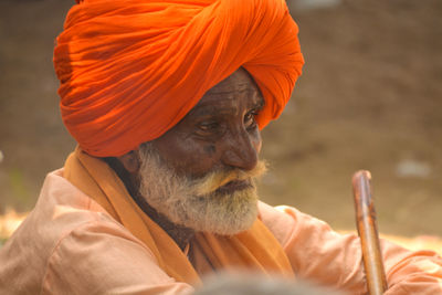 Close-up portrait of man with orange head