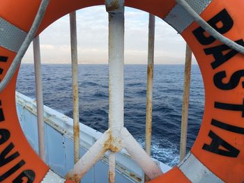 Cropped image of boat sailing in sea