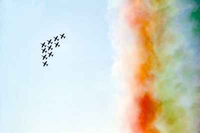 Low angle view of airshow flying in sky