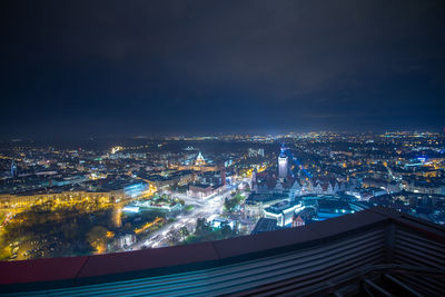 High angle view of illuminated buildings in city at night