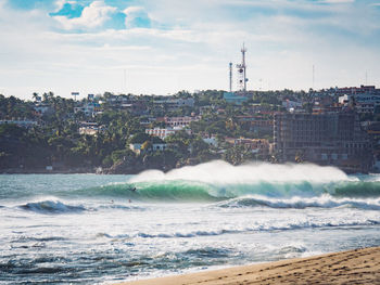 View of city against cloudy sky