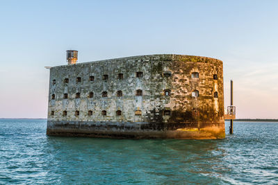 View of abandoned building at waterfront