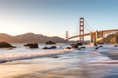 View of suspension bridge over sea