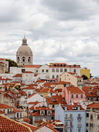 Buildings in city against sky