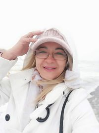 Portrait of smiling woman in snow