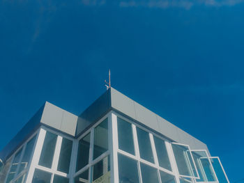 Low angle view of building against blue sky