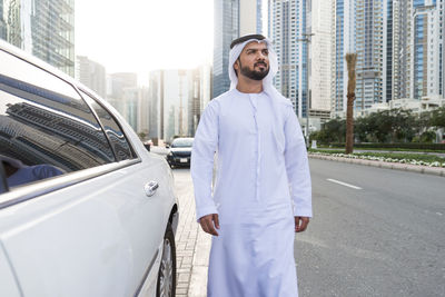 Full length of a man standing in city