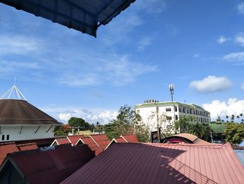 Houses against sky in city