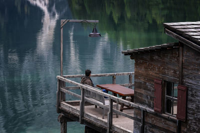 High angle view of man on pier over lake